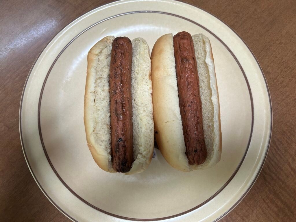 two hot dogs plated for a frugal living meal