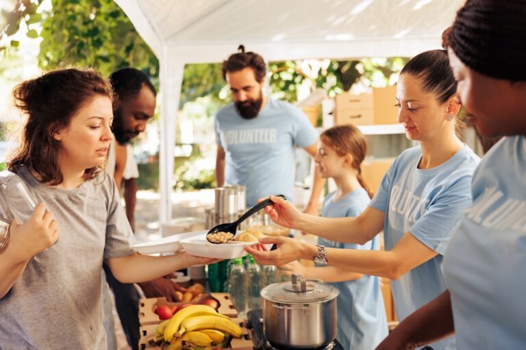 Individuals volunteering at a food bank