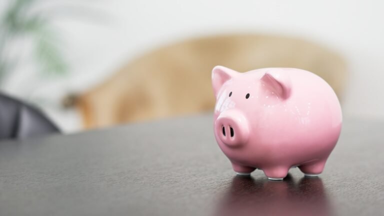 Pig money box on a desk