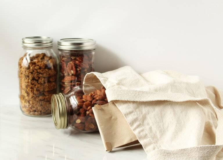 Sustainable shopping bag with nuts in glass jars