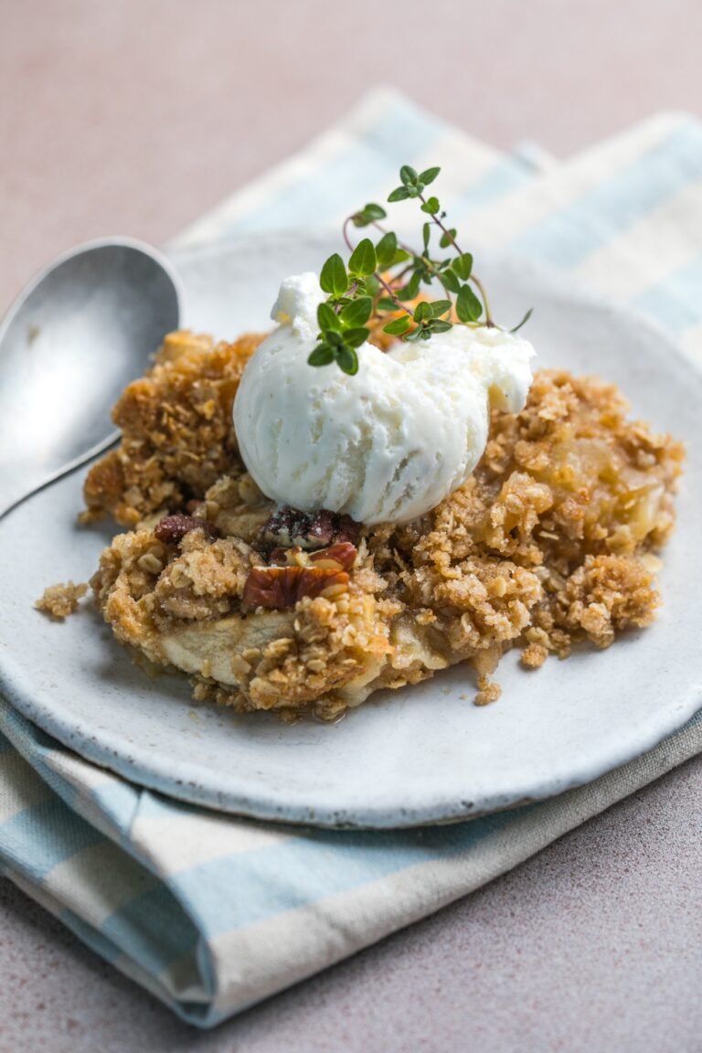 close up of apple crumble and ice cream