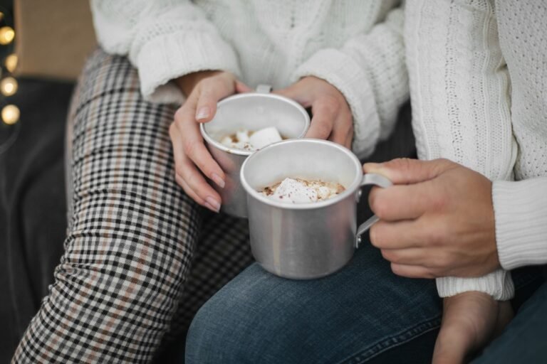 Couple in love drinking hot cocoa with marshmallows