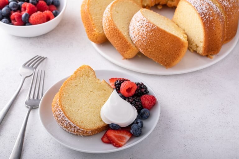 Sliced bundt pound cake with fresh berries